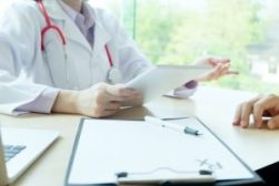 Doctor and patient are discussing something, just hands at the table